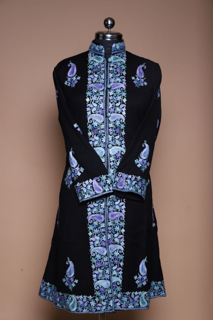 Front of the black long jacket with a high collar, blue and purple floral borders, scattered paisleys and crossed cuffs.