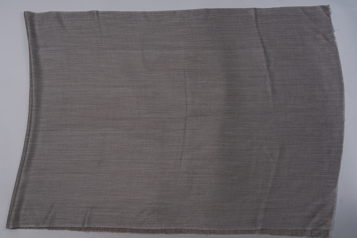 Lighter taupe face of the reversible stole laid flat, with a subtle woven texture and plain rectangular outline.