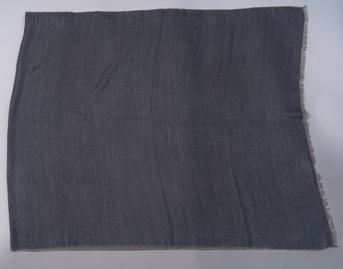 Charcoal face of the rectangular stole laid flat, showing a subtle woven texture and short pale fringe at the end.