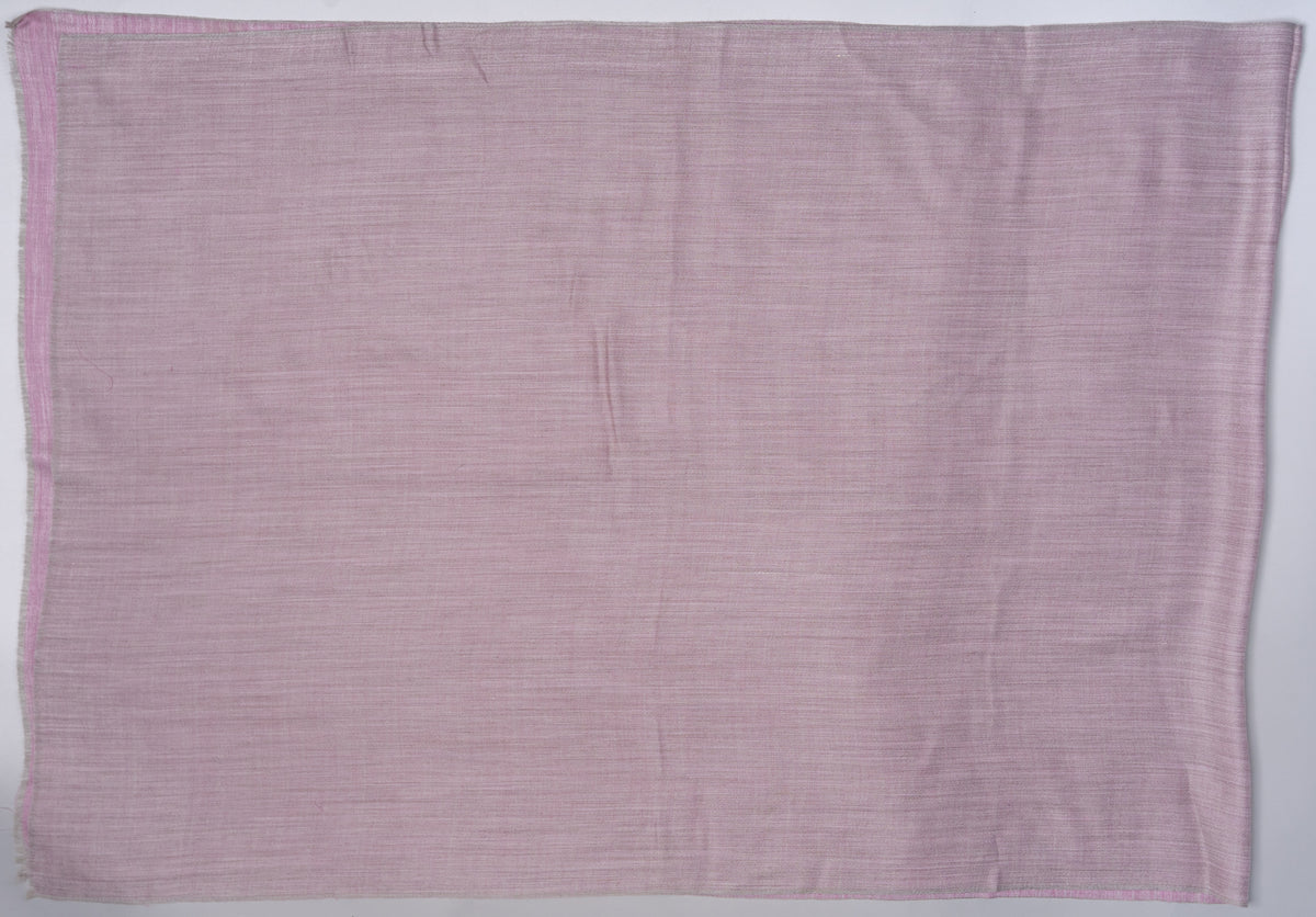 Mauve-grey reverse of a Merino wool stole laid flat, showing its fine weave and a narrow rose-pink border