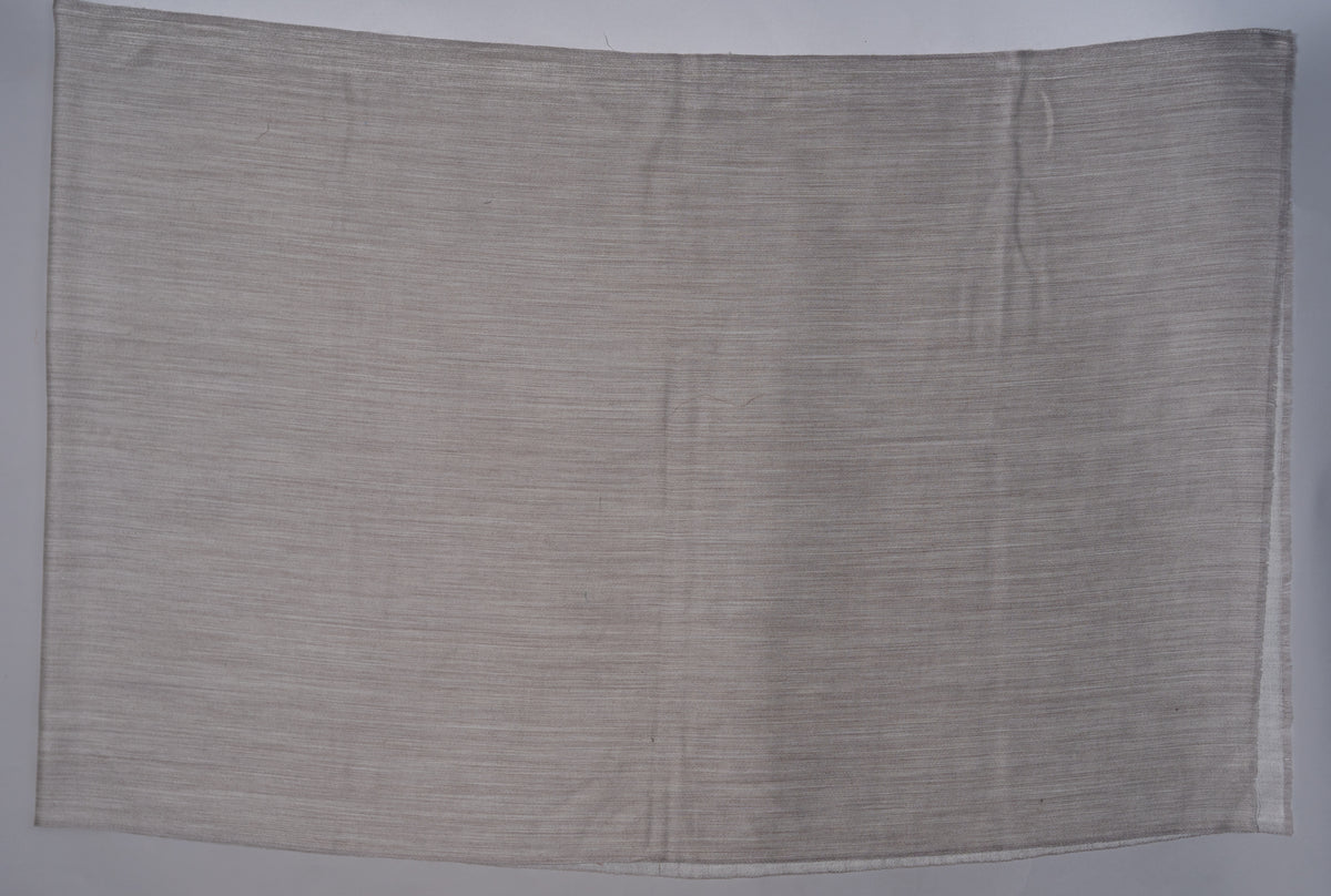 Taupe side of the reversible Merino wool stole spread flat, showing its plain weave and narrow finished edges