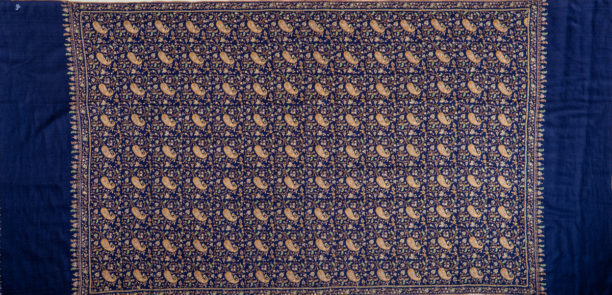 Full flat view of the midnight-blue Pashmina shawl, with paisley-and-vine embroidery framed by narrow borders and plain ends