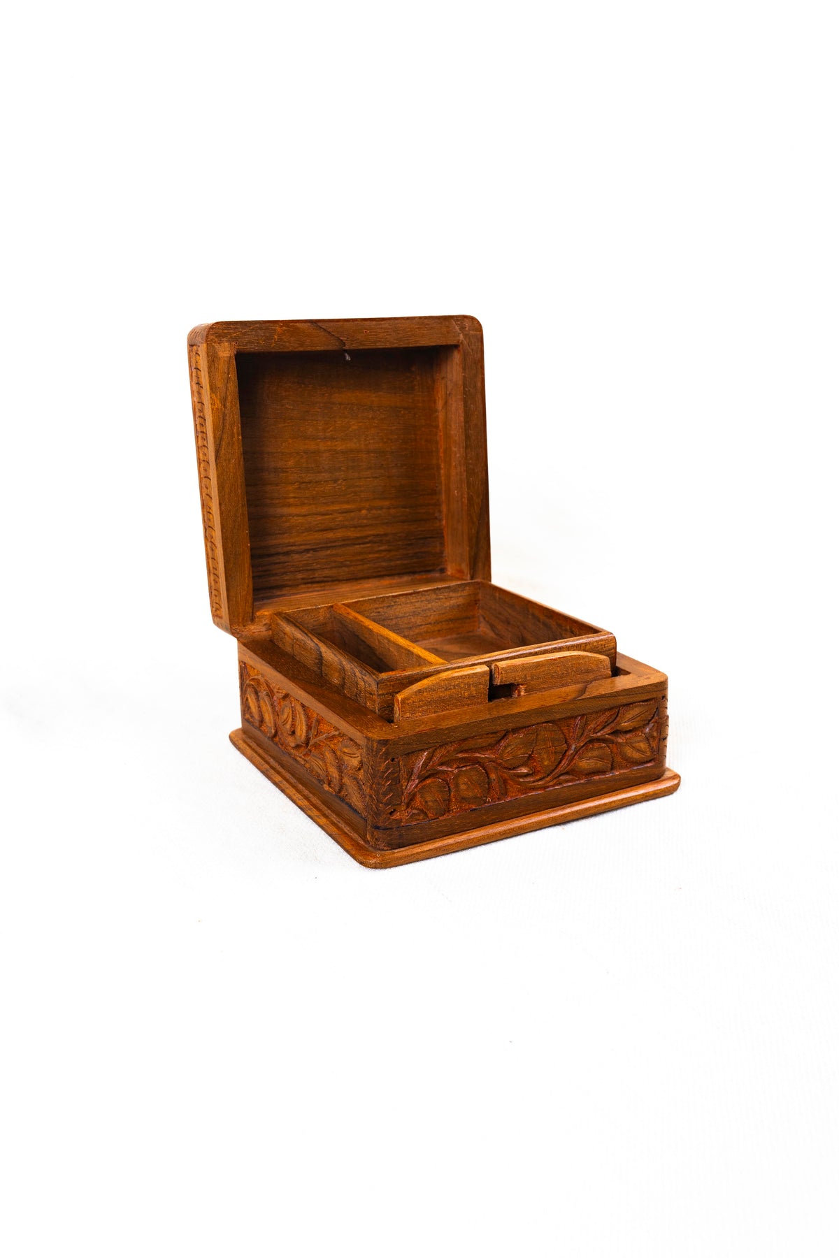 Angled front view of the open walnut wood box with an upright lid and two compartments in the inset tray.