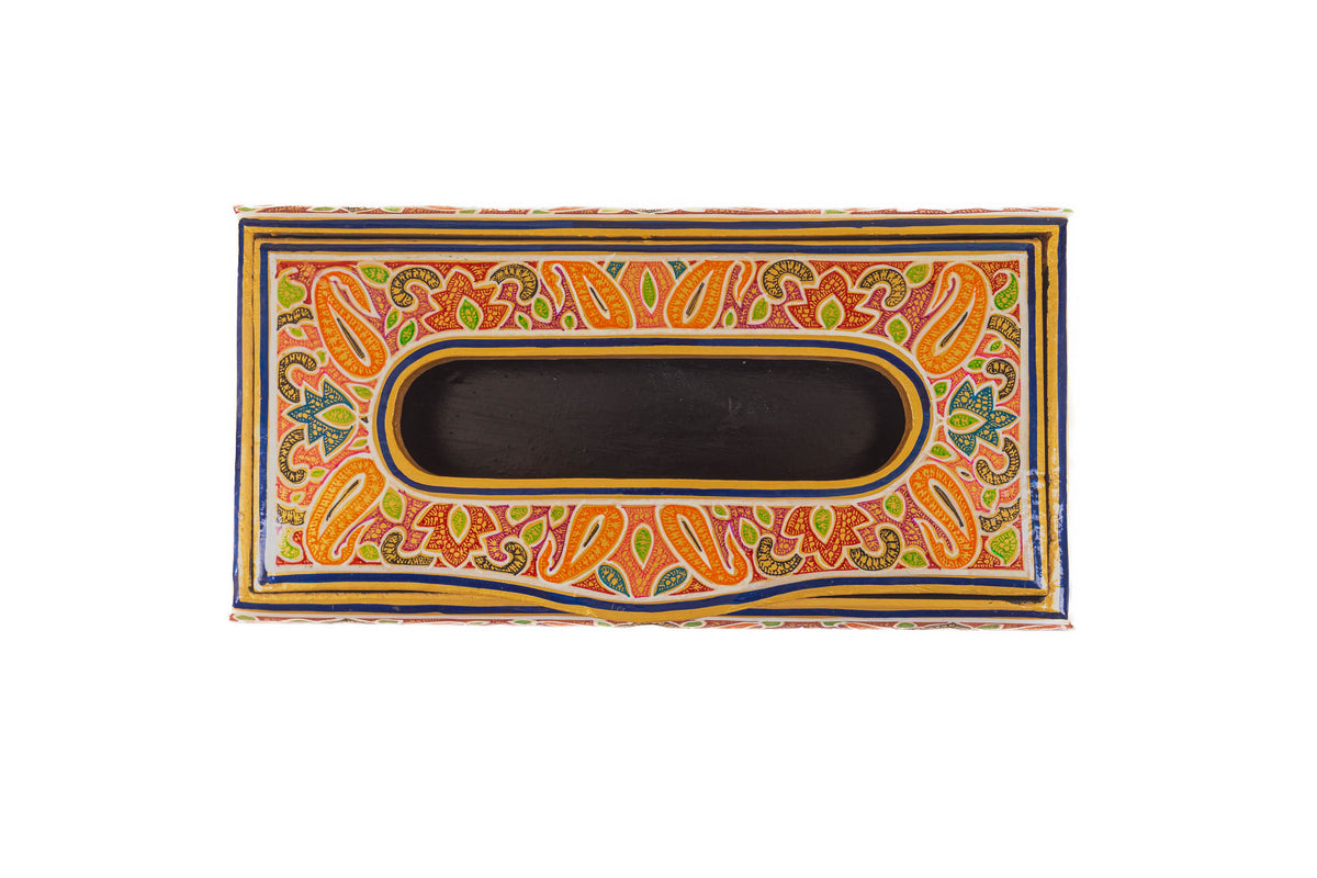 Top view of the empty paper mache tissue box, with an oval opening surrounded by orange paisleys and green leaves