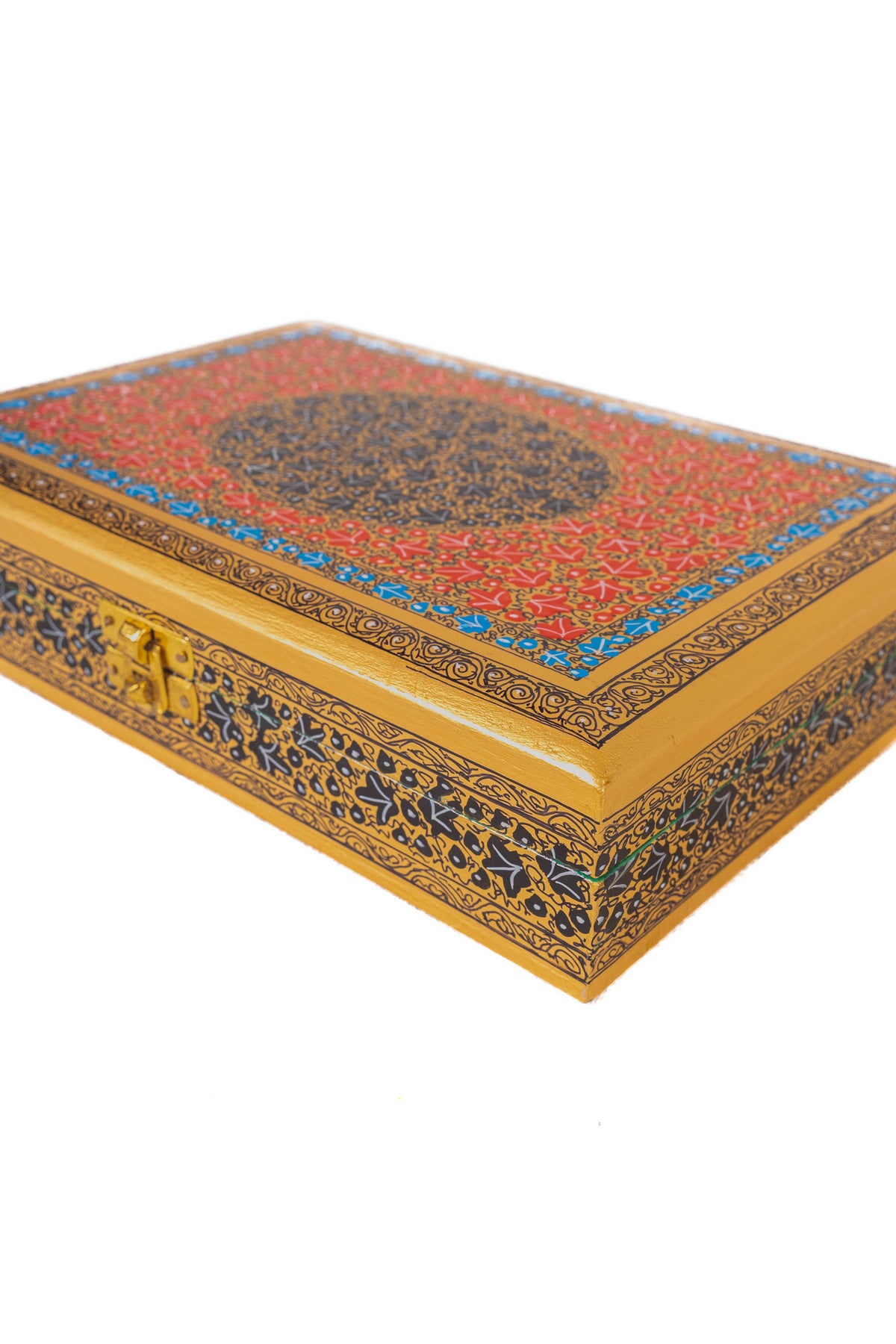 Close angled view of the closed box with red floral painting, gold trim, dark patterned sides and a small front clasp.