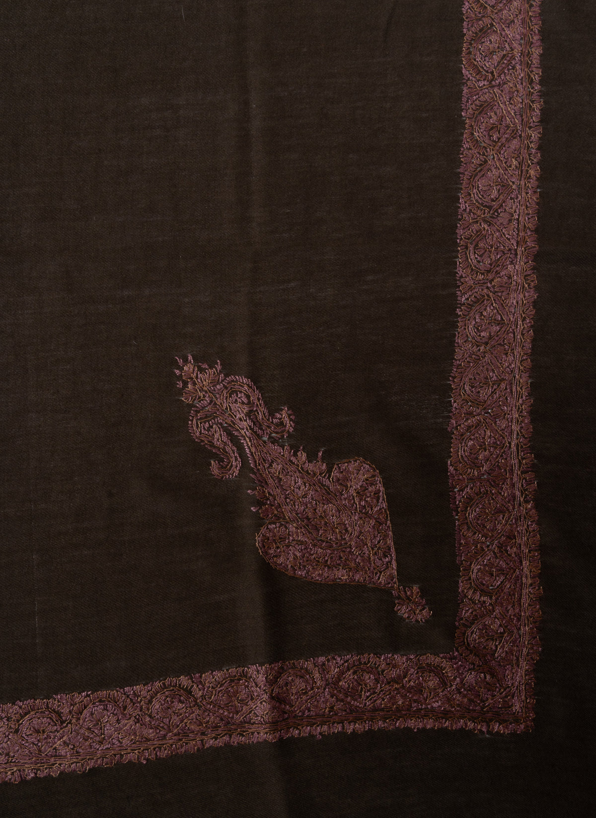 Cocoa-brown rumal corner with an elongated dusty rose Sozni floral motif beside a narrow embroidered border