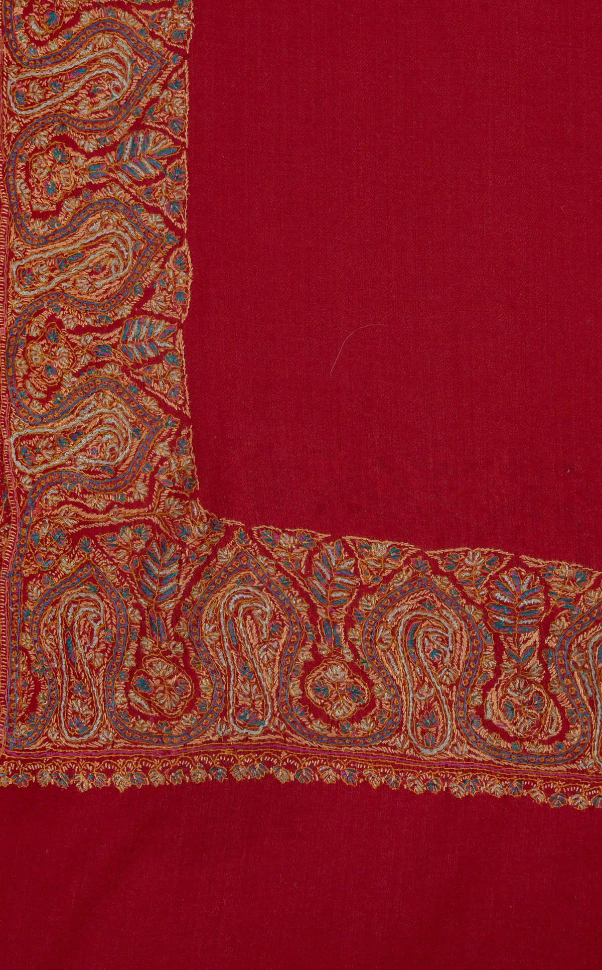 Corner of a scarlet shawl with intersecting golden Sozni paisley borders and blue-green floral accents