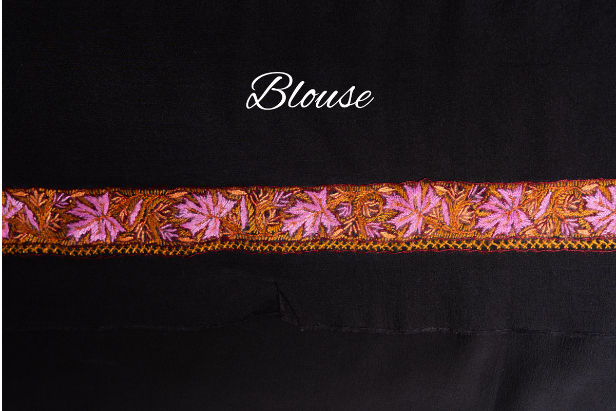 Black blouse fabric with a narrow orange and pink Sozni leaf border, labelled Blouse