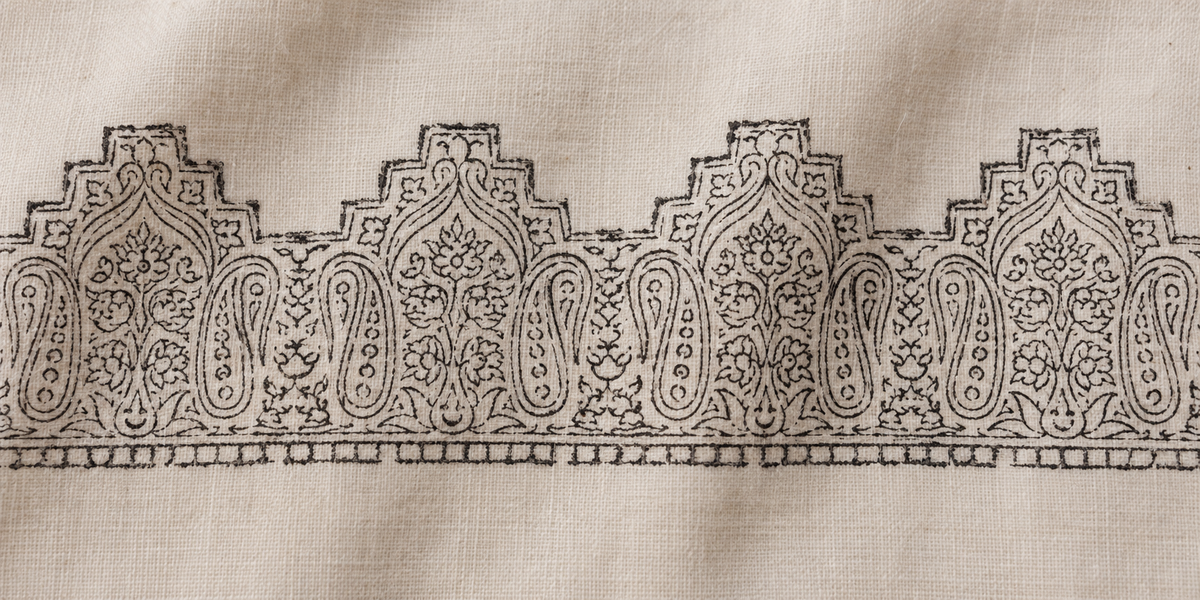 Illustrated chapai stage: a floral and paisley border printed on ivory shawl fabric before Sozni embroidery.