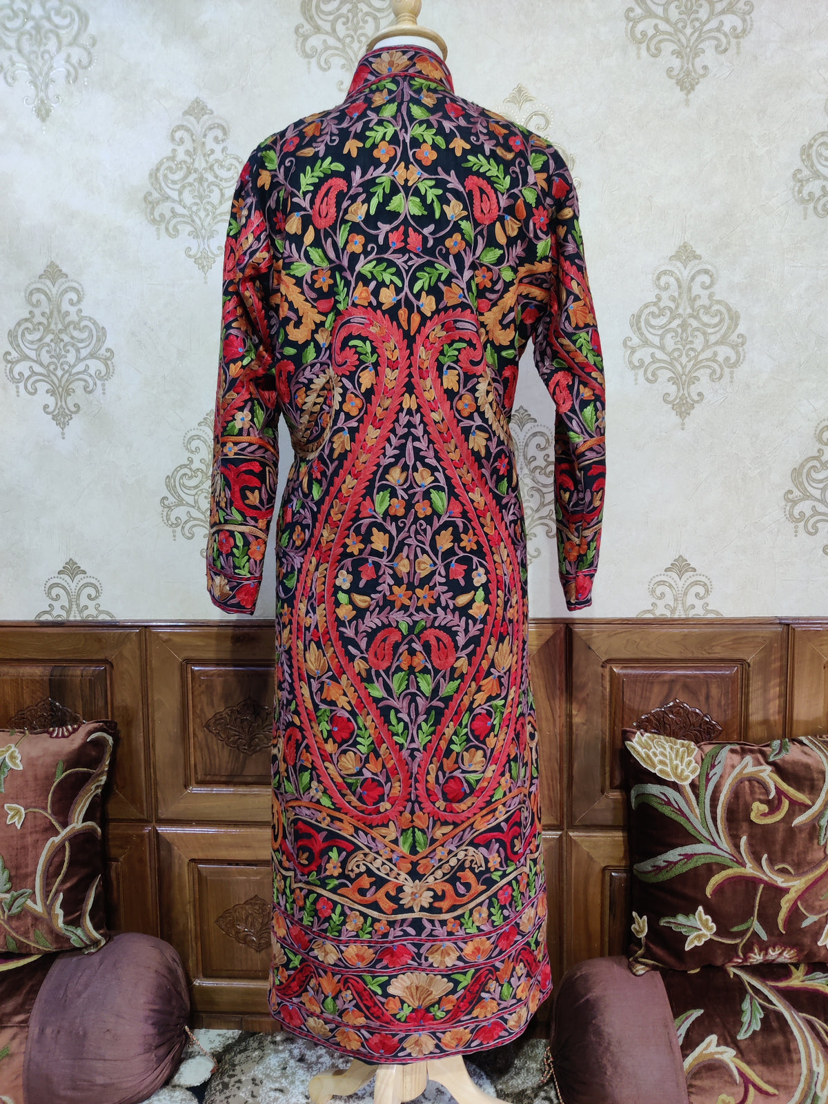 Full back of the black Midnight Mosaic jacket with large red-edged Aari paisleys filled with colourful flowers and leaves.