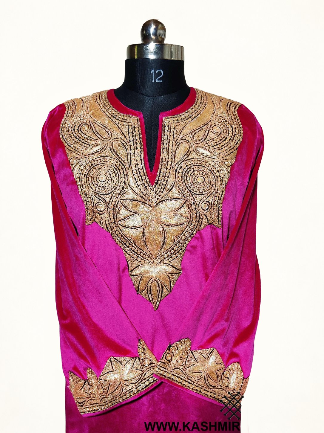 Front detail of the pink velvet pheran, with gold-toned Tilla flowers and paisleys around the slit neckline and on crossed cuffs