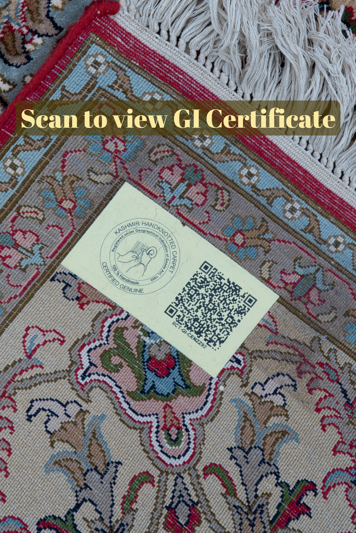 QR-code label on a folded crimson carpet corner beside white fringe, with the text Scan to view GI Certificate