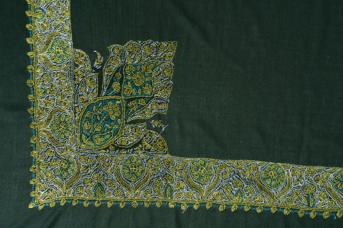 Corner detail of the green Merino wool rumal with a broad Sozni floral border and a large gold-teal motif