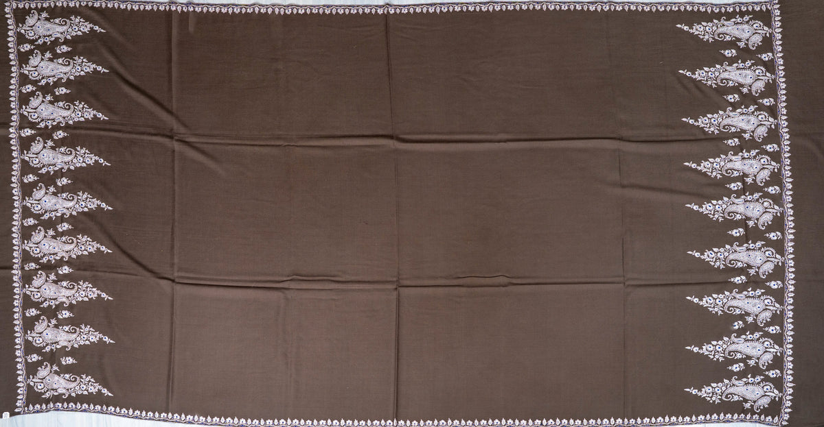 Full spread of the mocha-brown Pashmina shawl, with a plain centre, narrow floral edges and ivory paisley borders at both ends