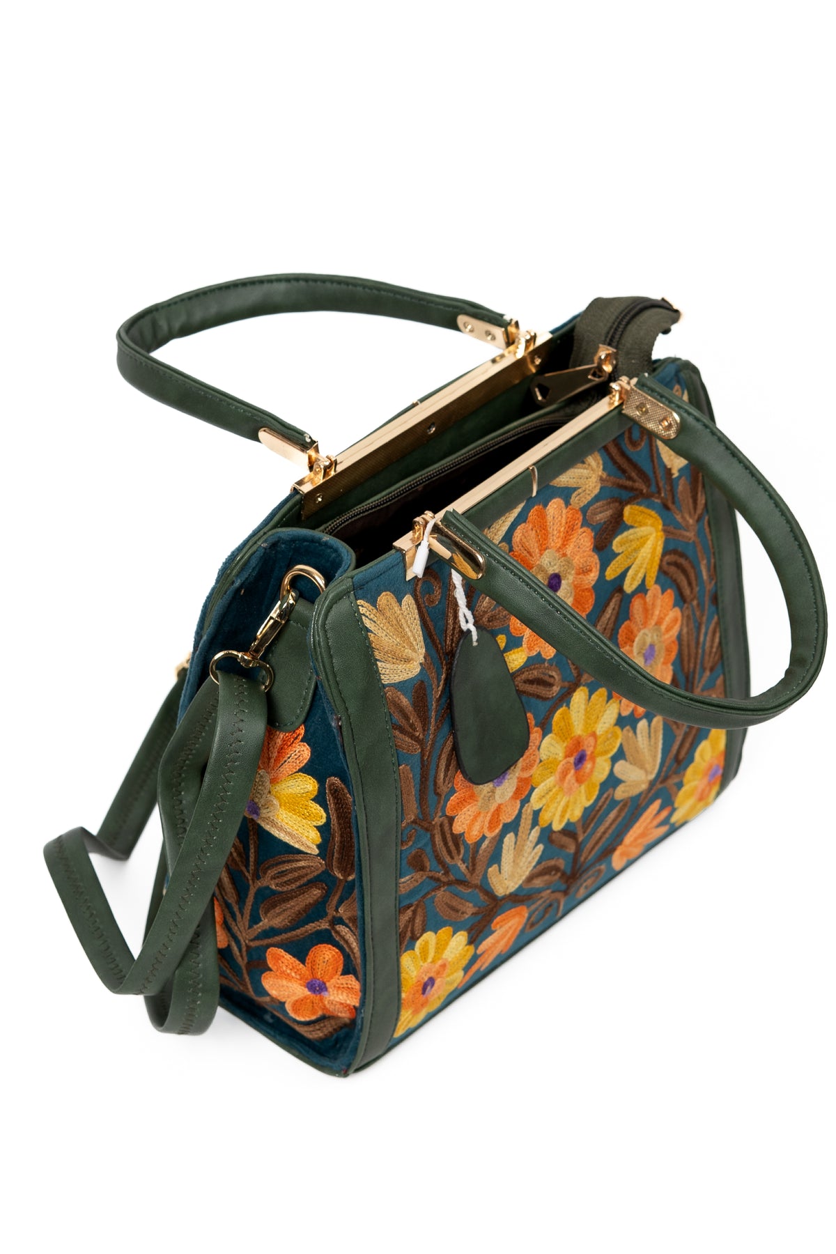 Open top view of a dark green floral handbag showing the zip opening, gold-toned frame and attached shoulder strap
