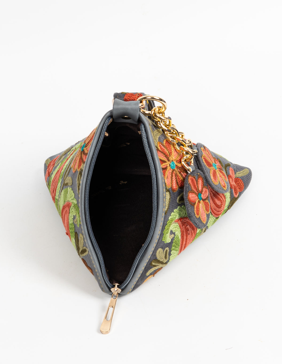 Open charcoal pyramid bag viewed from above, showing its dark lining and embroidered triangular sides