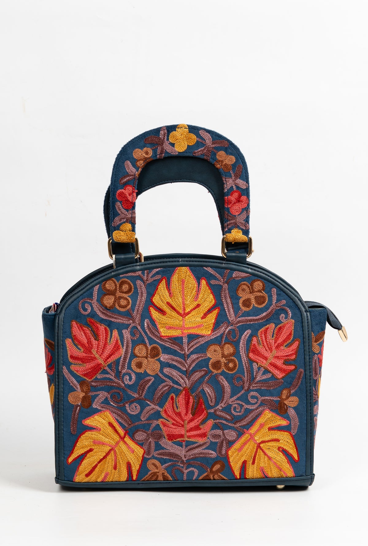 Front view of a navy handbag with symmetrical red and orange Aari leaves, curling vines and a matching embroidered handle