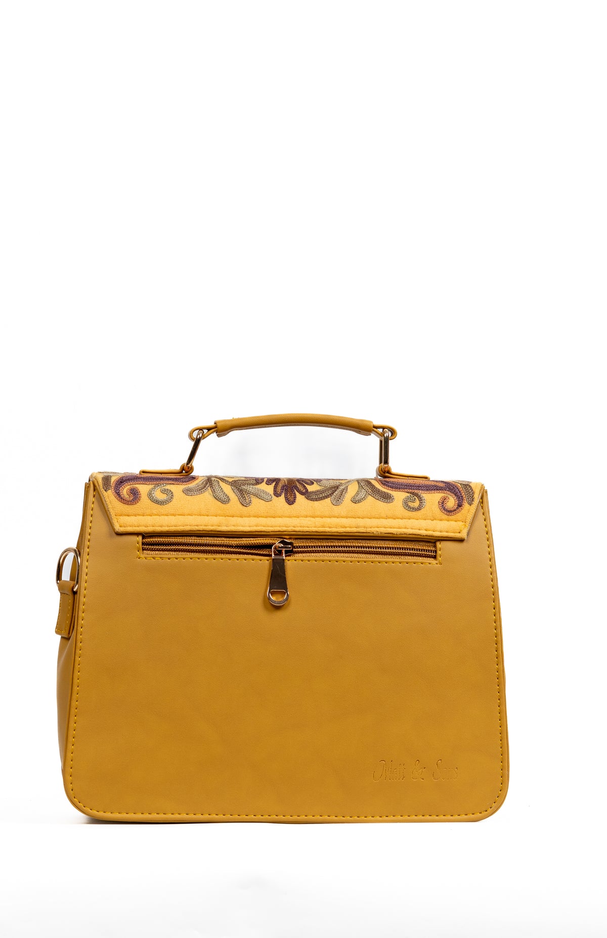 Back view of the mustard handbag showing a horizontal zip pocket beneath the embroidered flap edge.