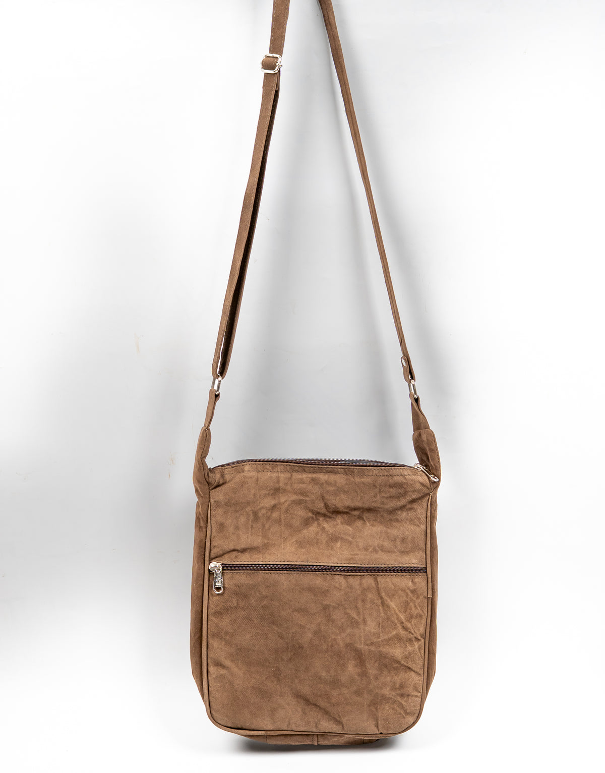 Back view of the brown messenger bag, showing a plain textured panel, horizontal zip pocket and adjustable strap.