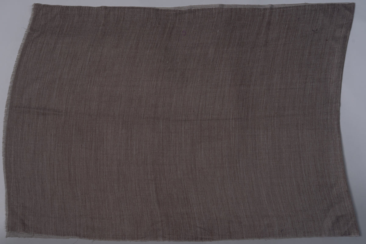 Mocha face of the rectangular stole laid flat, showing the plain field, fine weave and short fringed edges.