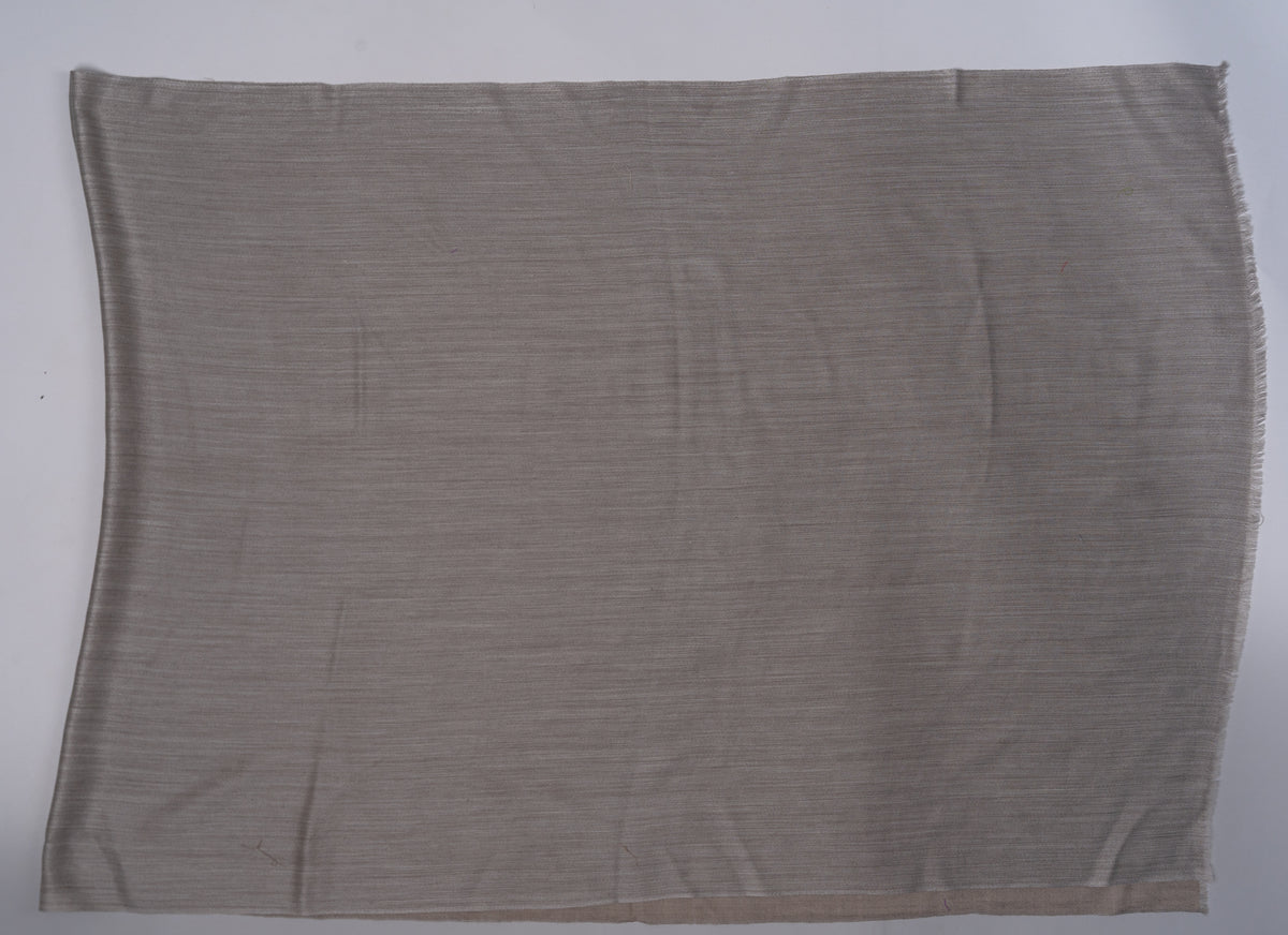 Sand beige reverse of the Merino wool stole laid flat, showing its fine weave and narrow finished edges