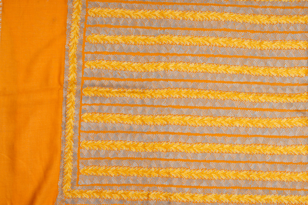 Golden stole laid flat with parallel yellow Aari leaf bands, pale openwork stripes and a plain orange end panel