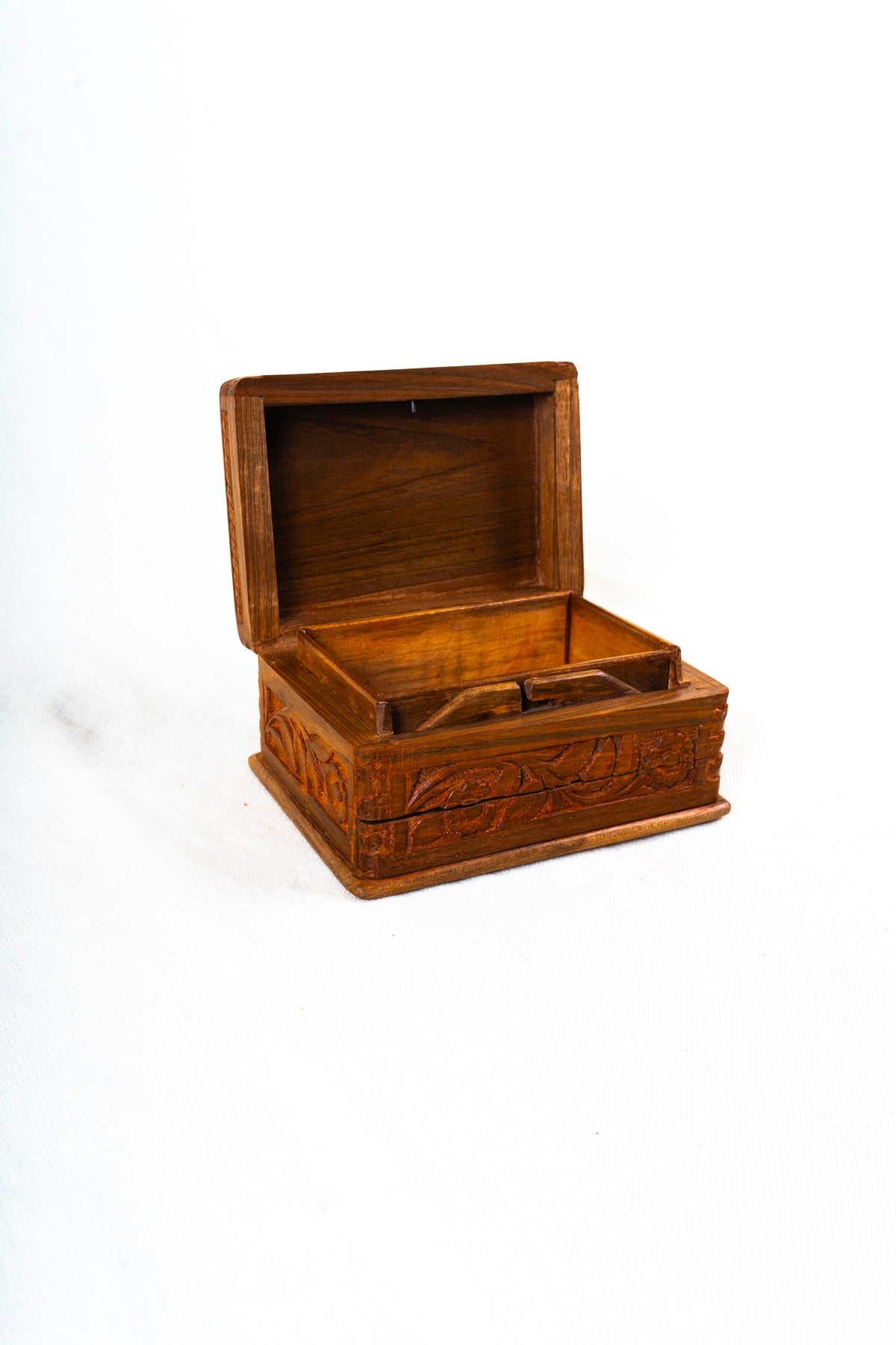 Open walnut wood decorative box viewed from the opposite angle, with a raised lid and visible wooden interior
