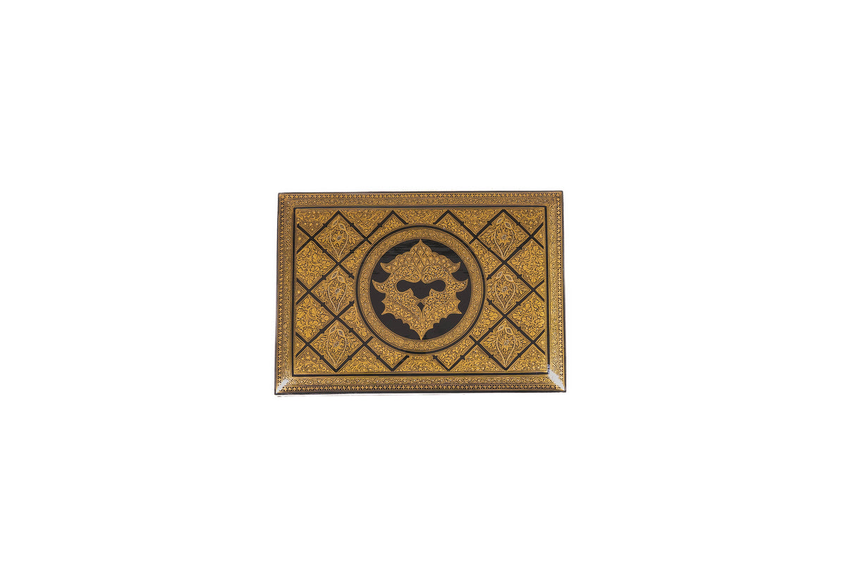 Top view of the closed paper mache box with a gold diamond grid and circular central medallion on black.