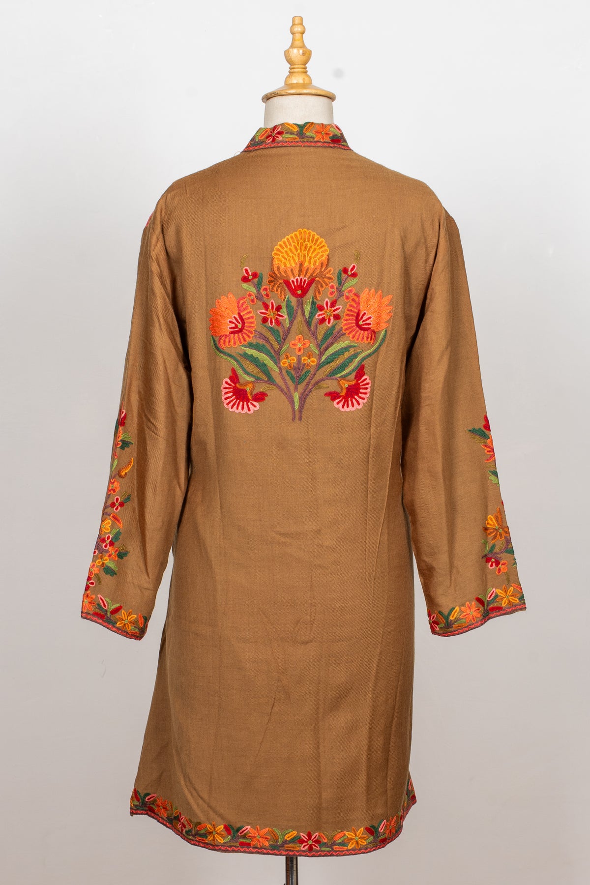 Back view of the earthy brown Hand Aari jacket, showing a central floral motif and embroidered cuffs and hem