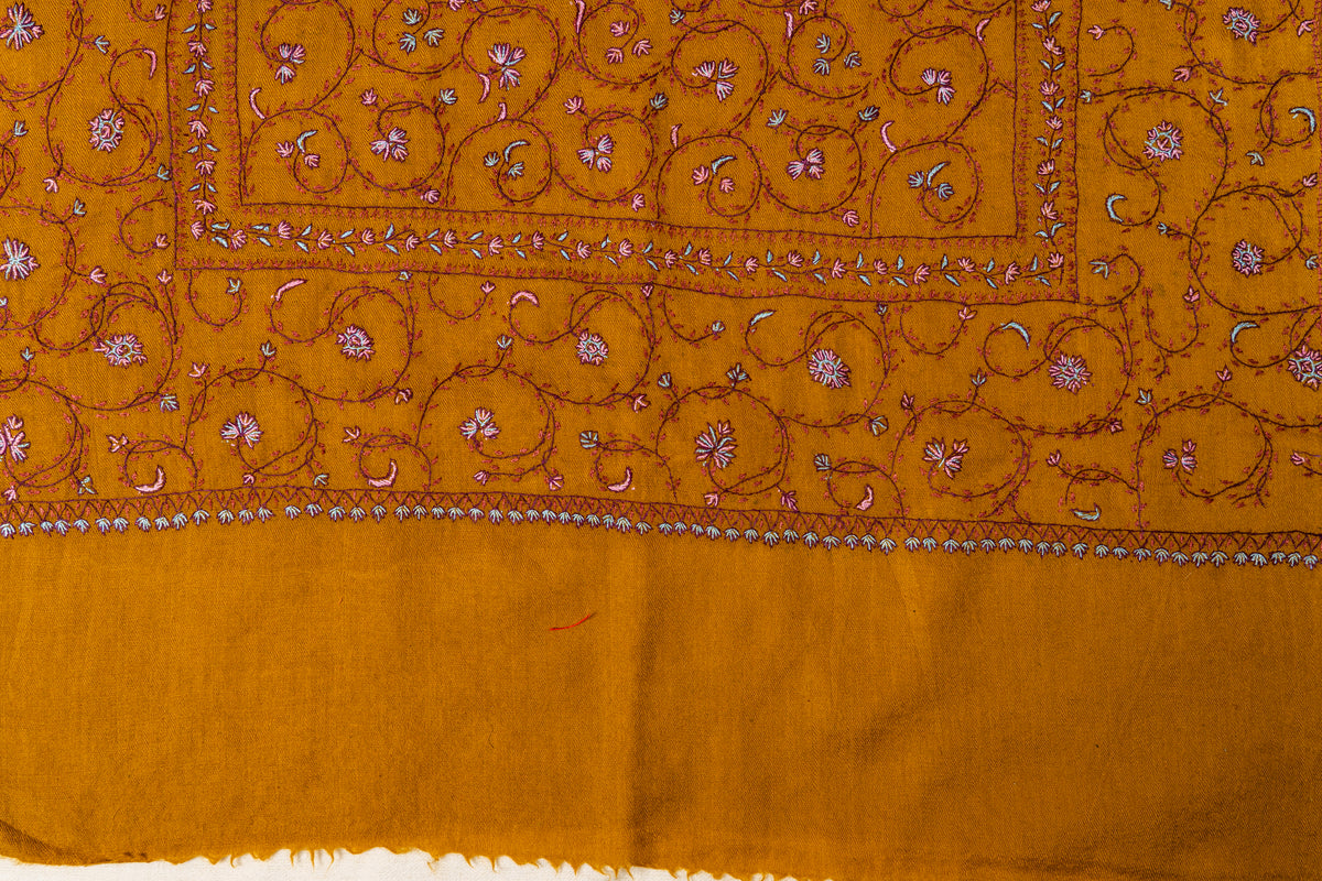 Mustard stole end with pink and white Sozni floral vines above a plain fringed margin