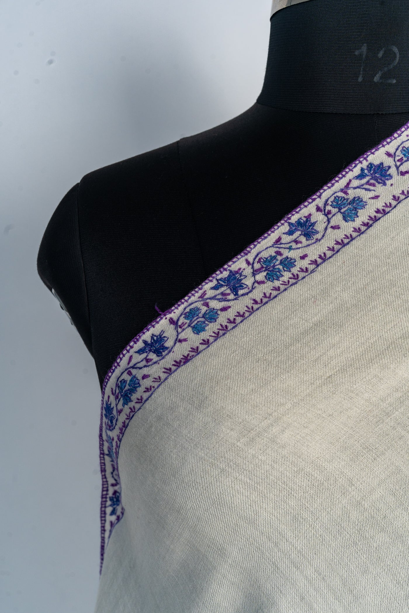 Ivory Majesty: Hand-Embroidered Sozni Merino Wool Shawl with Purple Motifs