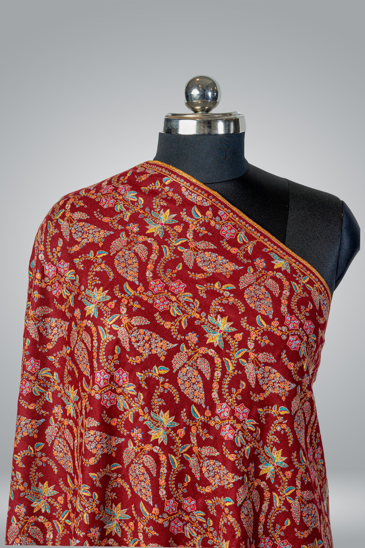 Regal Maroon Tapestry: A Luxurious Pure Pashmina Shawl Embellished with Artisanal Sozni Embroidery - KashmKari