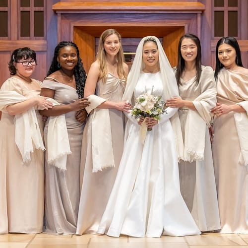 Hosana and her bridesmaids wearing their ivory shawls
