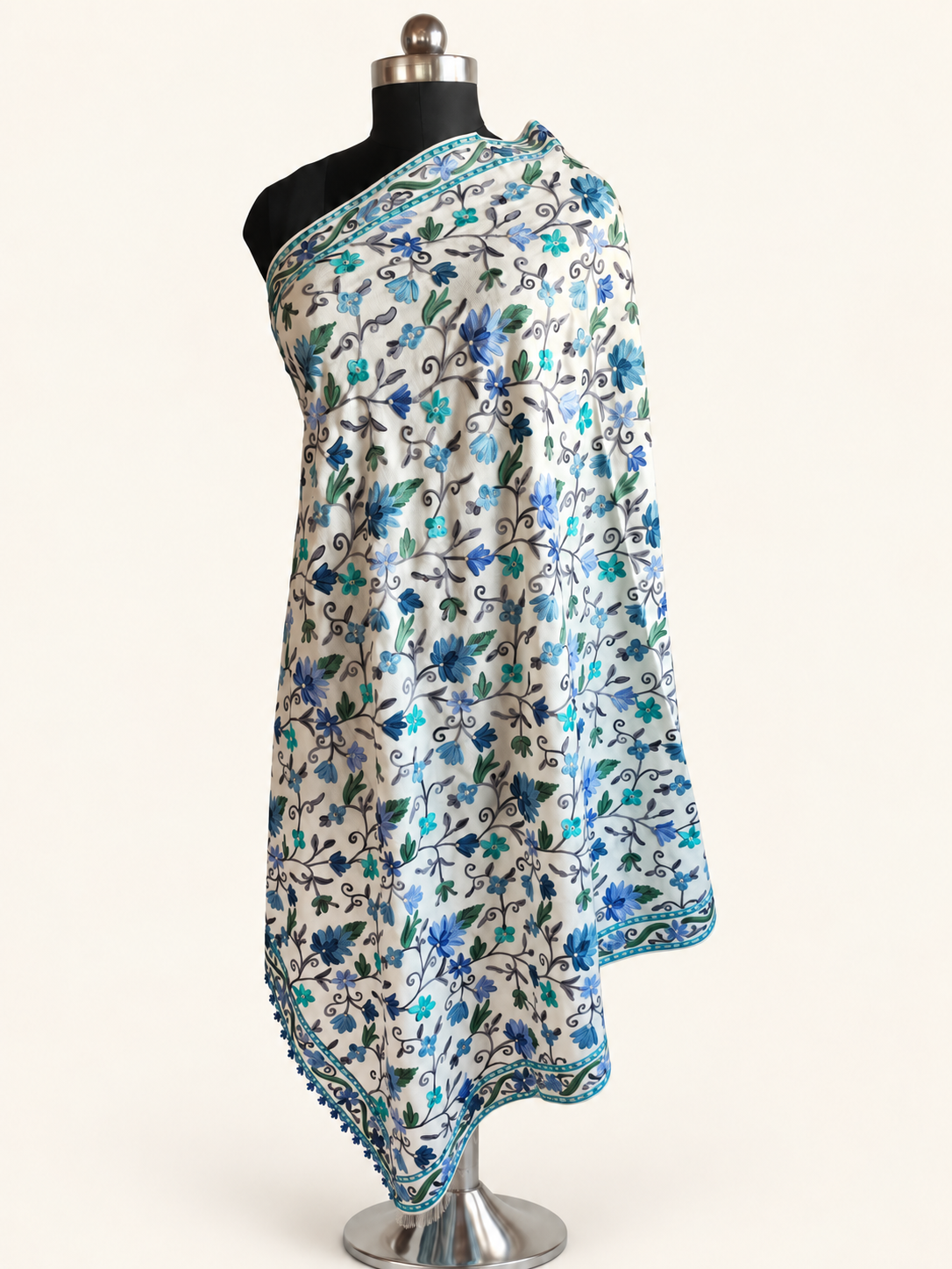 White fine Merino wool shawl with blue and green Aari floral embroidery, alternate full draped studio view