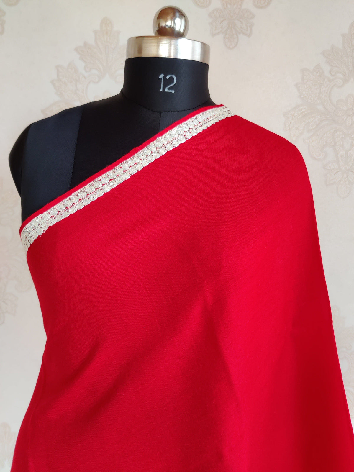Upper drape of red Merino wool scarf with a plain centre and narrow silver-toned Tilla embroidered side border