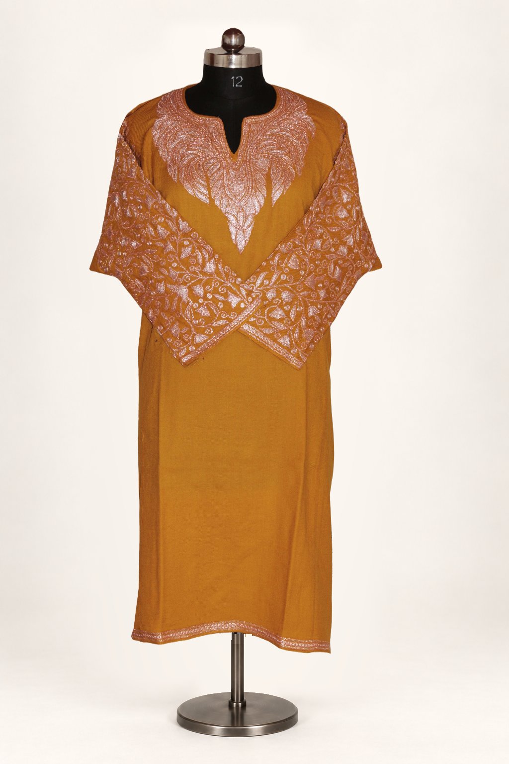 Mustard Pheran with pale floral Tilla embroidery around the notched neckline and across the sleeves