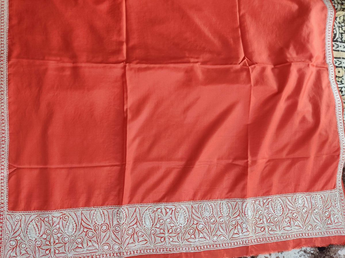 Red silk dupatta laid flat, showing a plain centre, narrow side trim and broad silver-toned Tilla floral end border